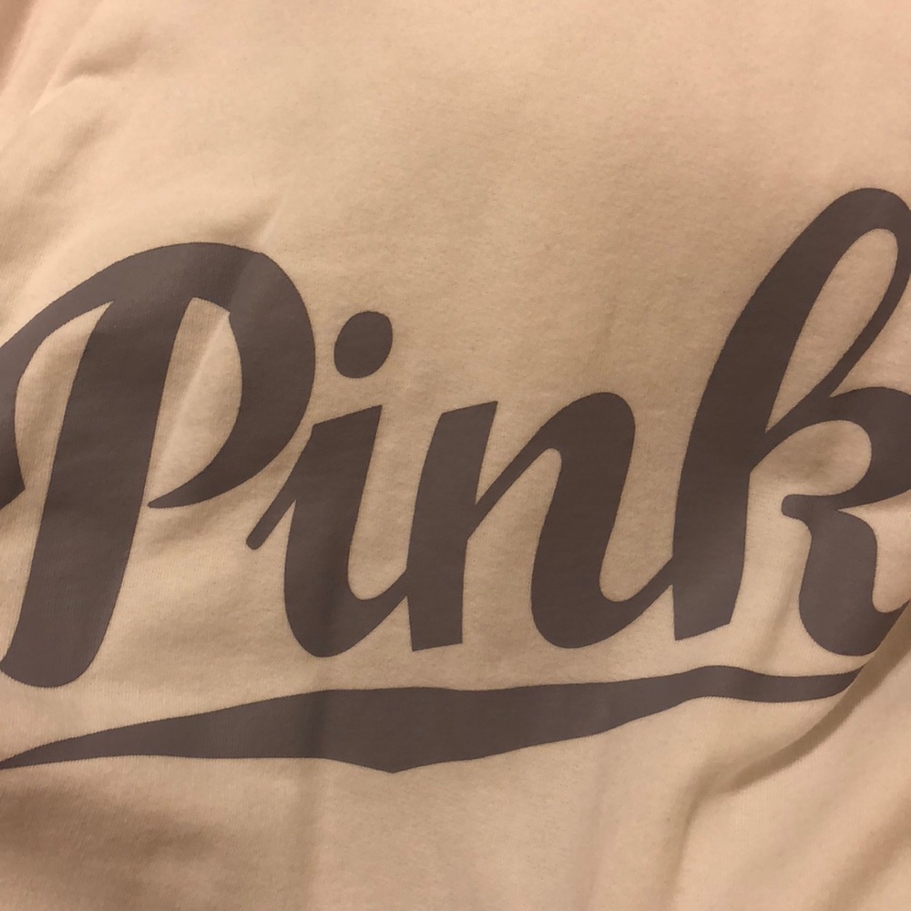 pink long sleeve with ripped shoulders